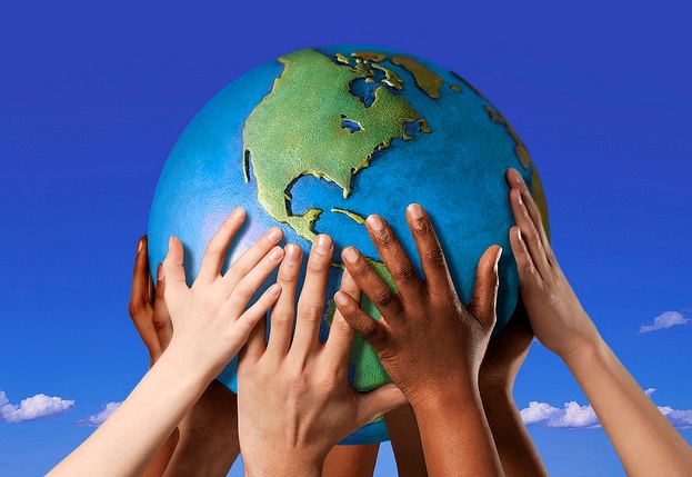 Hands on a globe --- Image by ?Royalty-Free/Corbis